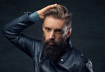 Portrait of bearded male dressed in leather jacket.