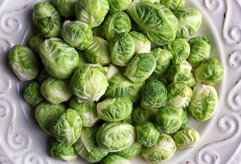 Fototapeta premium Brussels sprouts on plate, closeup