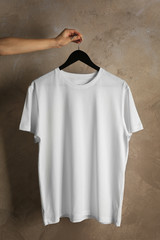 Blank white t-shirt on grunge background