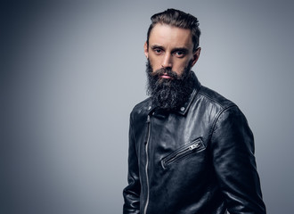 Bearded male dressed in black leather jacket.