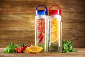 Healthy detox water with fruits on table