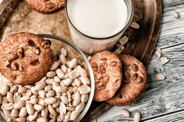 Peanut cookies with milk on metal tray