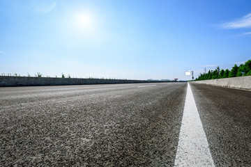 Asphalt road under the blue sky