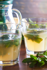 Fototapeta na wymiar Homemade lemonade with mint, selective focus