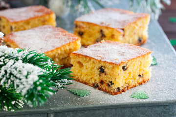 Orange cake with chocolate chips in the Christmas decor, horizontal