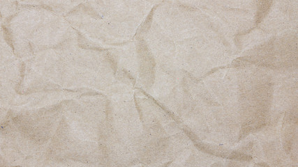 Recycled crumpled brown paper texture or paper background for design with copy space for text or image.