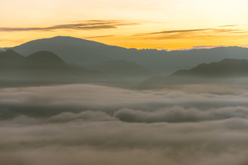 Sunrise and sea of clouds over Pai District Mae Hong Son, THAILAND. View from Yun Lai Viewpoint is located about 5 km to the West of Pai town centre above the Chinese Village.