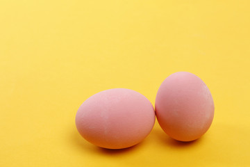 Preserved egg on yellow background, Asian Traditional Food, pink