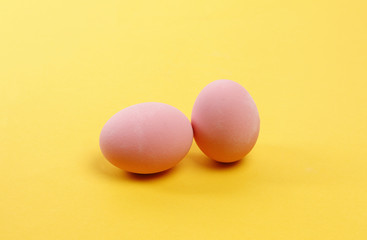 Preserved egg on yellow background, Asian Traditional Food, pink