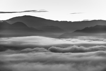 Sunrise and sea of clouds over Pai District Mae Hong Son, THAILAND. View from Yun Lai Viewpoint is located about 5 km to the West of Pai town centre above the Chinese Village.