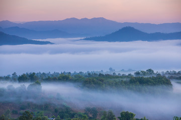 Obraz na płótnie Canvas Sunrise and sea of clouds over Pai District Mae Hong Son, THAILAND. View from Yun Lai Viewpoint is located about 5 km to the West of Pai town centre above the Chinese Village.