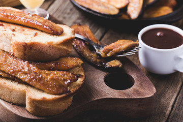 Brioche sandwiches with bananas in caramel sauce