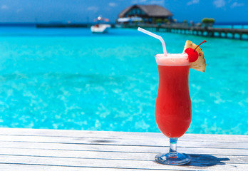 cocktail with blur beach on background