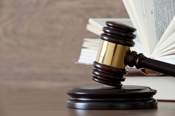 wooden gavel and books