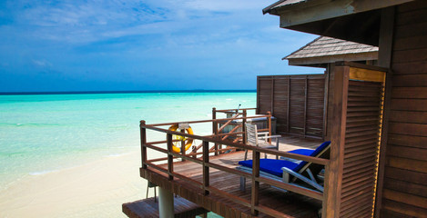 beach with water bungalows at Maldives