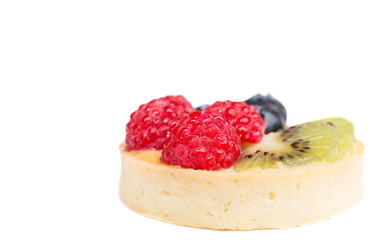 Selected focus homemade fruit tart with berries and kiwi isolate