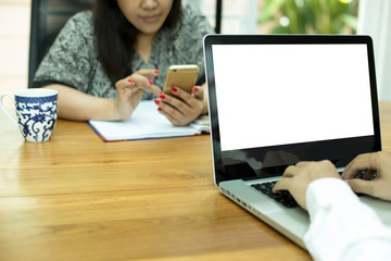 Business team work man's hands using notebook with woman using c