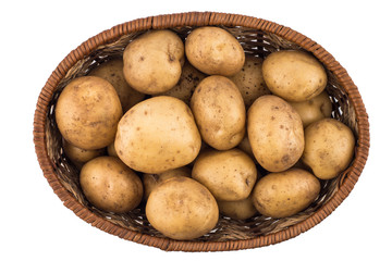 Raw potatoes in basket on white background.