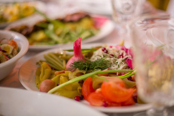 marinated vegetables with garlic on the holiday table