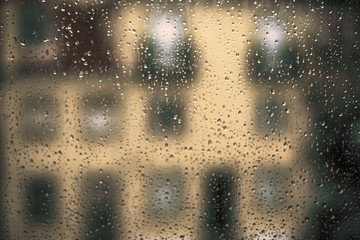 Drops Of Rain On Window as Background. Rainy autumn day. Soft co