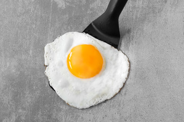 Fried egg on a spatula