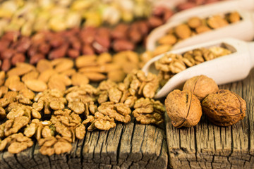 Walnuts in a wooden scoop, nut mix