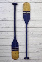 Blue oar wood hang on white wood background