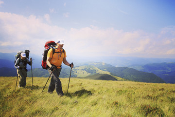 Man tourist walking the mountains with a backpack. © Vitalii Nesterchuk
