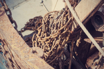 Rusty chains fishing trawlers net system.