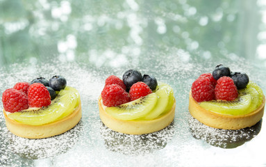 Fresh homemade fruit tart with berries and kiwi