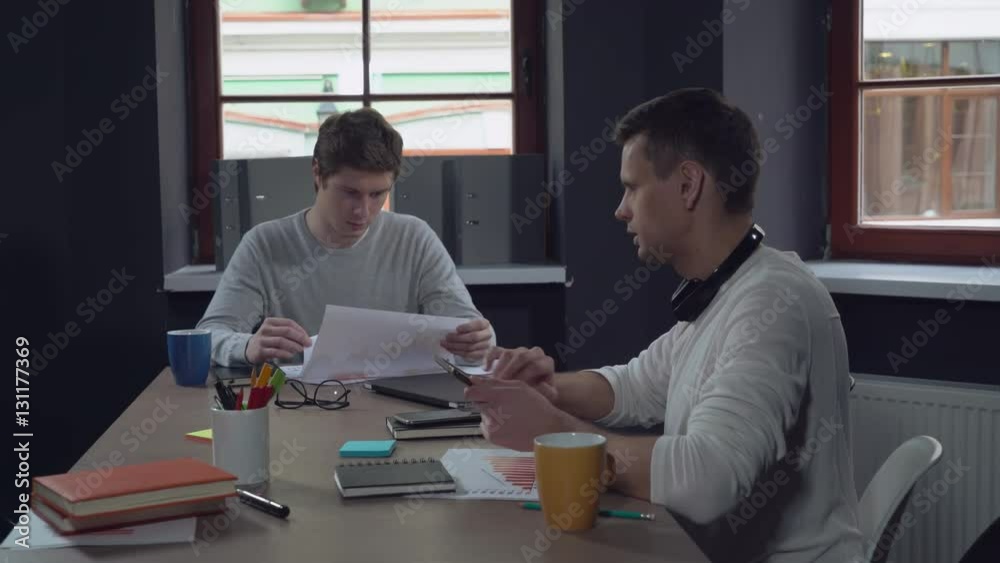 Aufkleber professional businessman discussing with colleagues new project in the modern contemporary office.ha