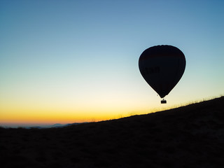 Silhouette of hot air balloons flying over the Cappadocia valley