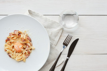 Traditional italian pasta carbonara with bacon and egg