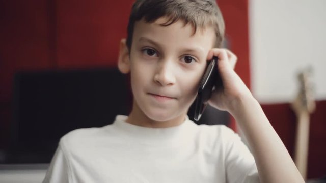 Little boy talking on a cell phone