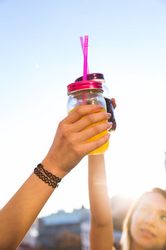 Women clanging their drinks