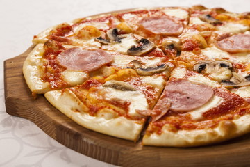 Pizza with ham and mushrooms