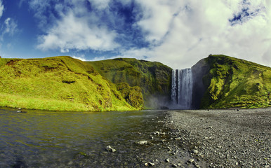 Naklejka na ściany i meble famous Skogarfoss waterfall in southern Iceland. treking in Iceland. Travel and landscape photography concept