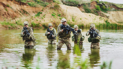 special forces soldiers with weapon take part in military maneuv