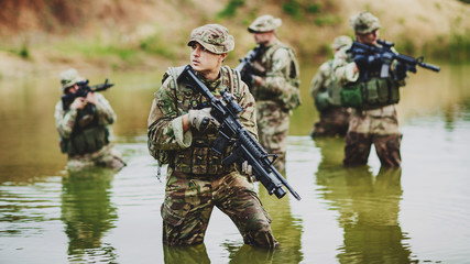 special forces soldiers with weapon take part in military maneuv