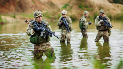 special forces soldiers with weapon take part in military maneuv