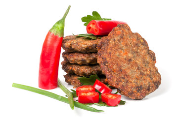 liver pancakes or cutlets with chili pepper and green onions isolated on white background