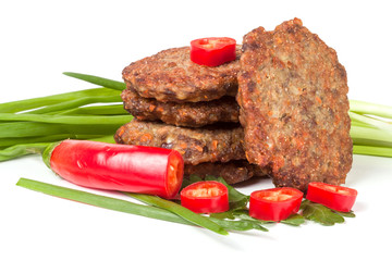 liver pancakes or cutlets with chili pepper and green onions isolated on white background