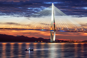 Obraz premium Iron bridge and fishing boat