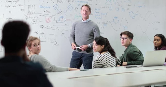 Professor asking student a question in lesson