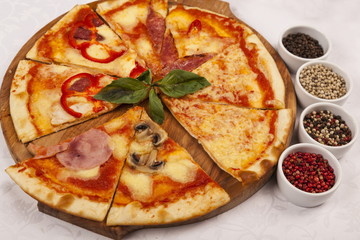 Pizza with at and set different peppers