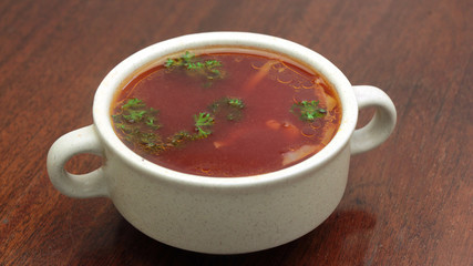 Traditional Ukrainian Russian vegetable borscht on the old wooden background