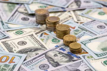 dollar bills and us coin as background.