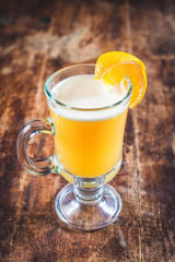 Orange and coffee cocktail on the wooden background. Shallow depth of field.