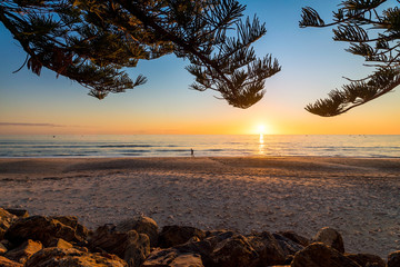 Jogging on the beach at sunset