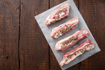 Raw meat. Pork ribs with herbs and spices